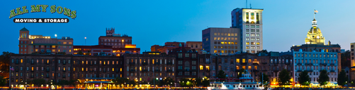 savannah buildings along river street lit up at night