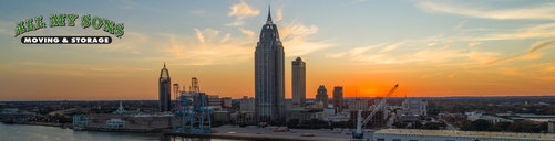 mobile, alabama skyline along mobile bay at sunset